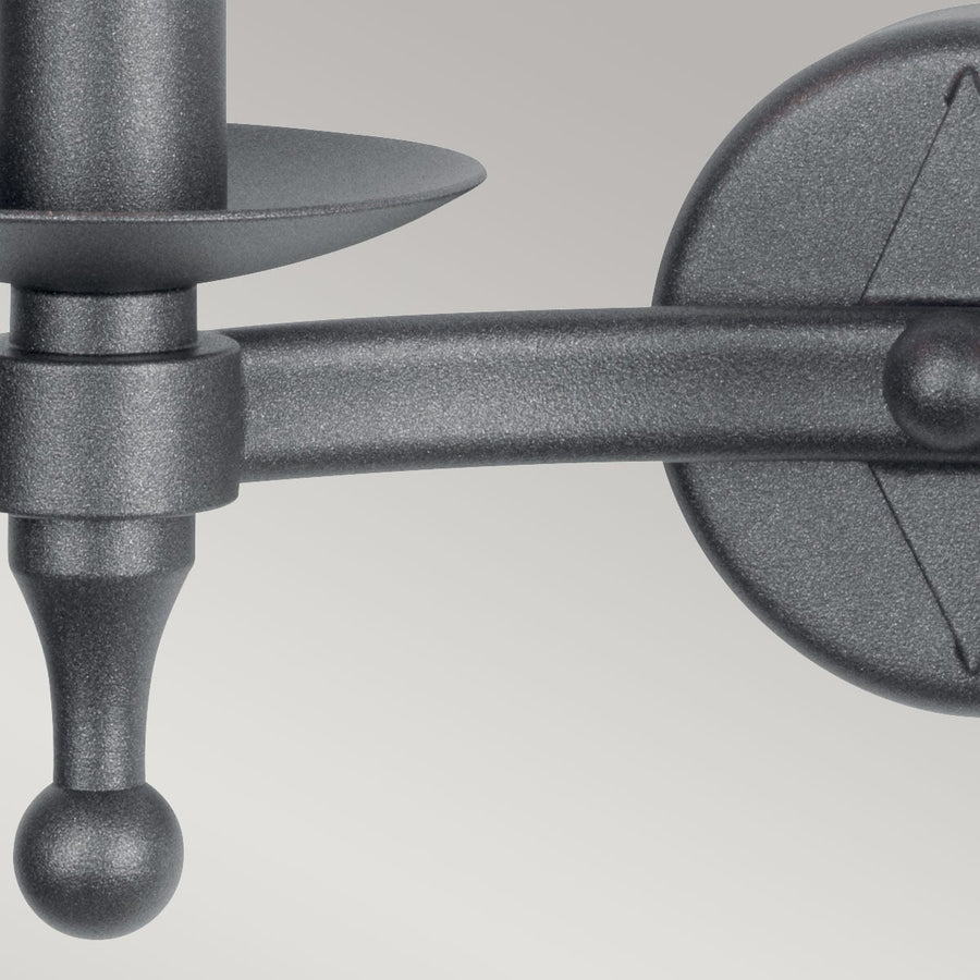 Détail de la finition texturée anthracite sur le bras et la coupelle