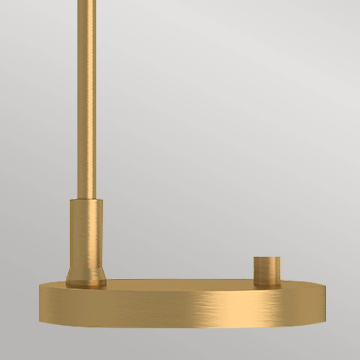 Détail de la base ronde et du pied cylindrique doré de la lampe.