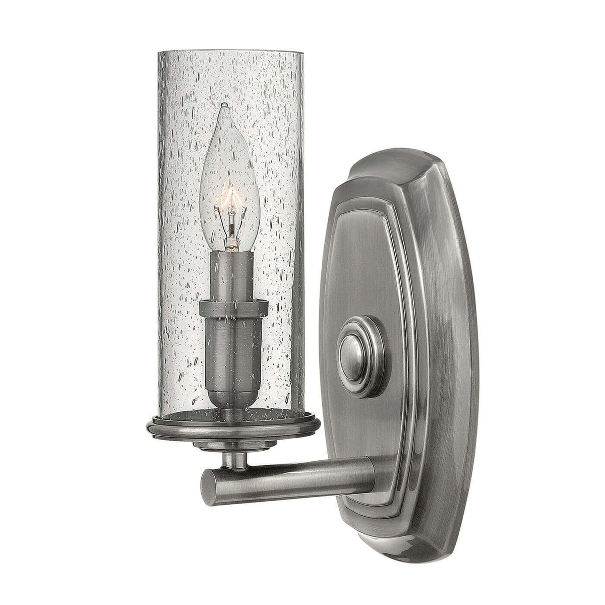 Applique murale en nickel brossé avec verre cylindrique et ampoule visible de face.
