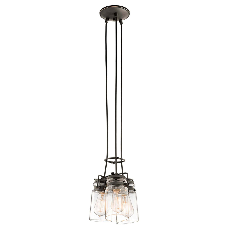 Vue entière du luminaire suspendu avec ses trois câbles noirs et ses diffuseurs en verre.