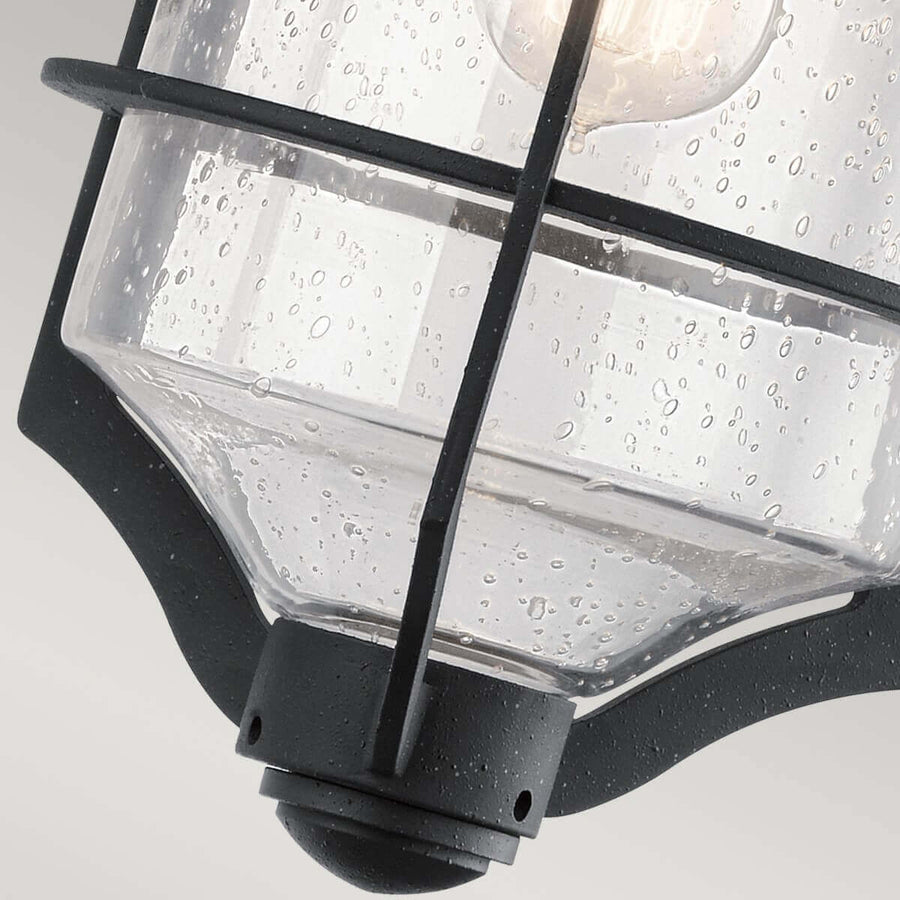 Détail du bas : verre strié, barreaux de cage et embout sphérique