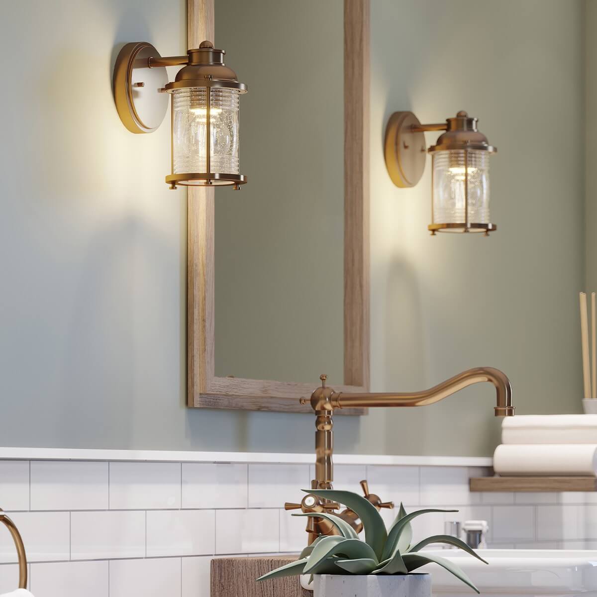 Mise en ambiance dans une salle de bain avec deux appliques encadrant un miroir
