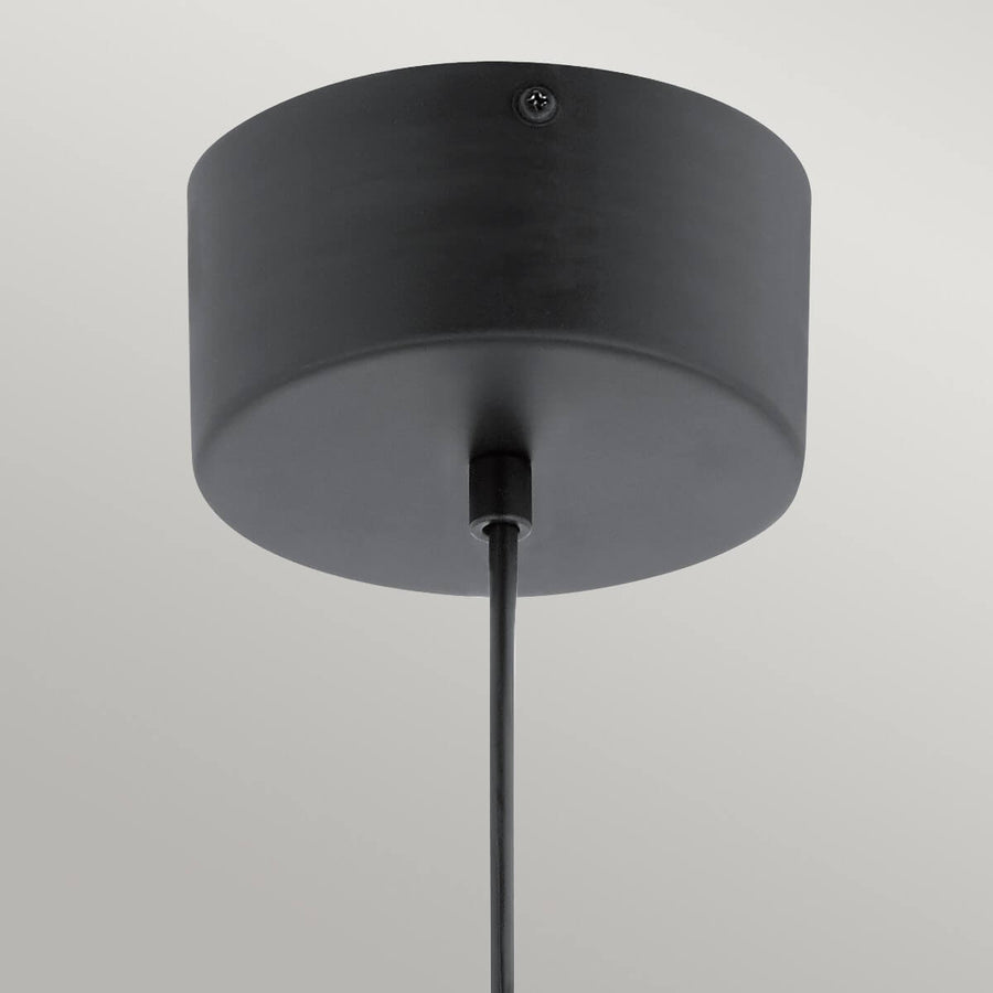Détail de la rosace cylindrique noire mate et de son câble