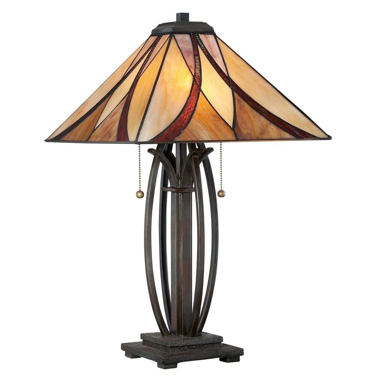 Lampe à poser de face sur fond blanc, abat-jour en verre coloré allumé et base bronze.