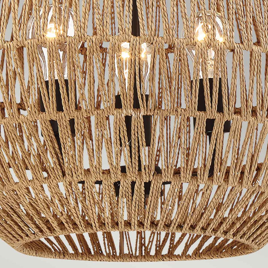 Zoom sur l'intérieur de la cage en corde tressée, trois ampoules allumées et structure noire.