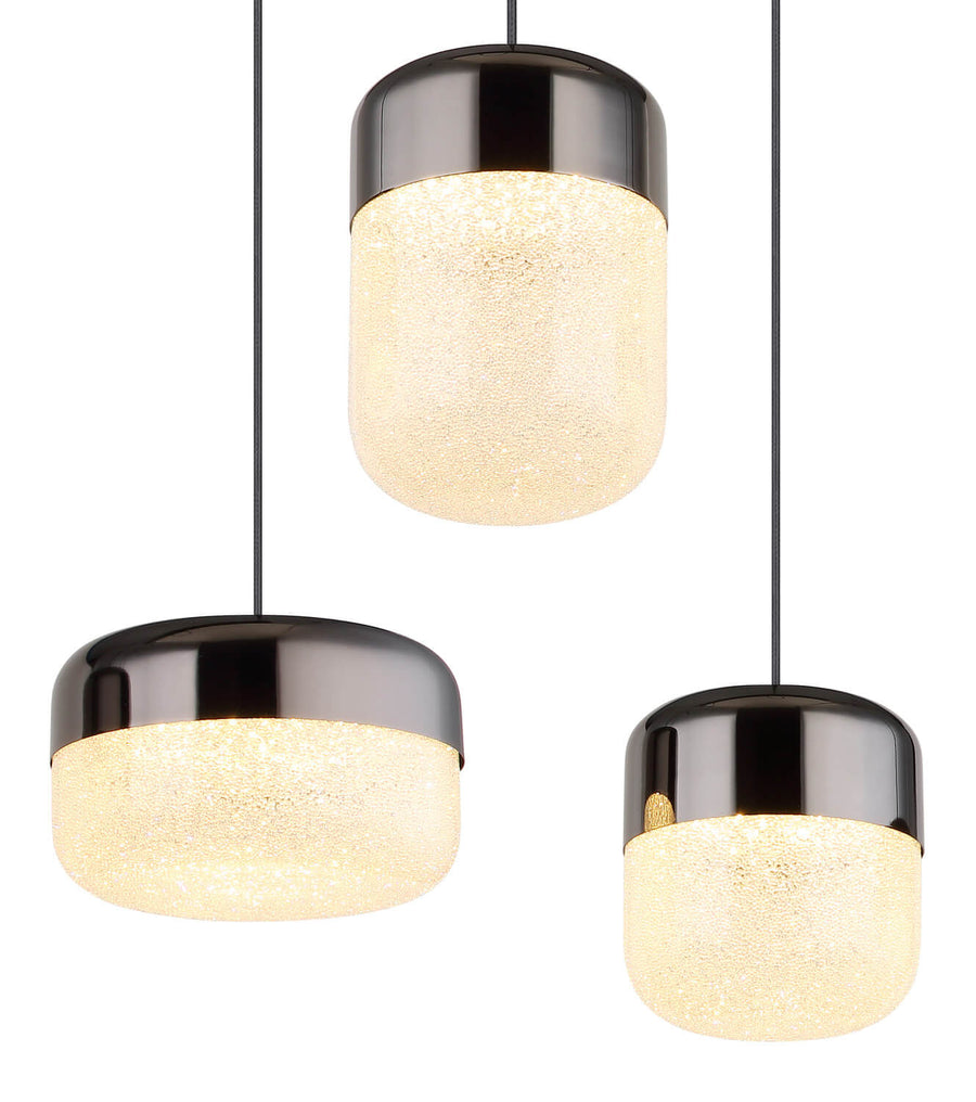 Gros plan sur trois abat-jours cylindriques illuminés, détail de la finition anthracite brillante