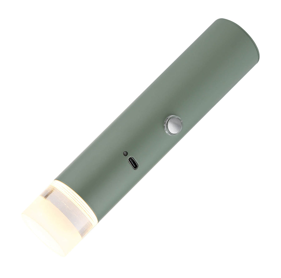 Produit présenté incliné sur fond blanc, corps vert mat et embout lumineux ivoire