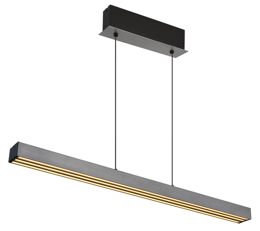 Détail du luminaire allumé en lumière chaude dorée sur fond blanc neutre.