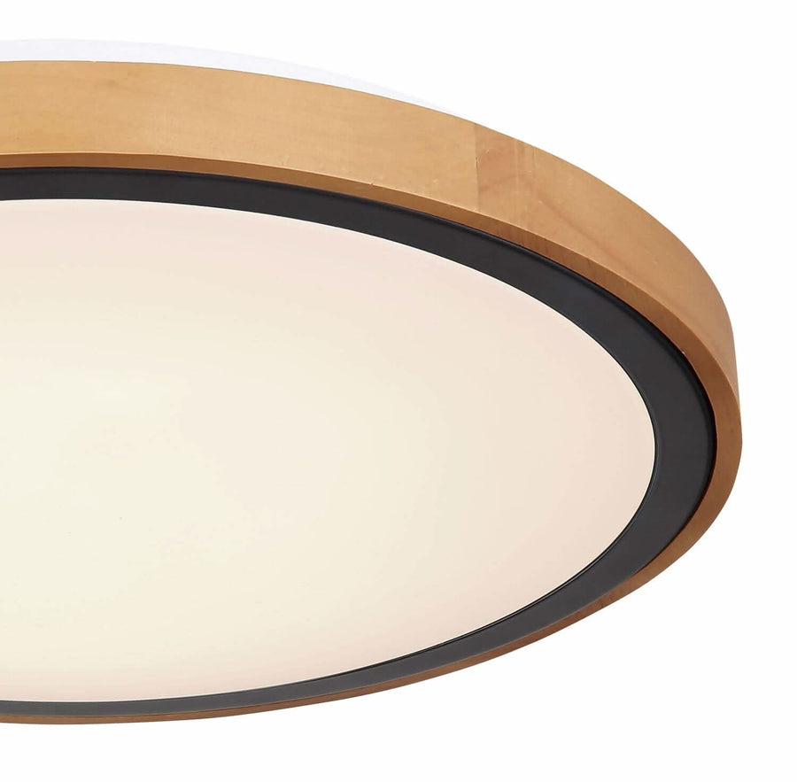 Détail rapproché du bord : cerclage bois verni, jonc noir mat et verre opalin