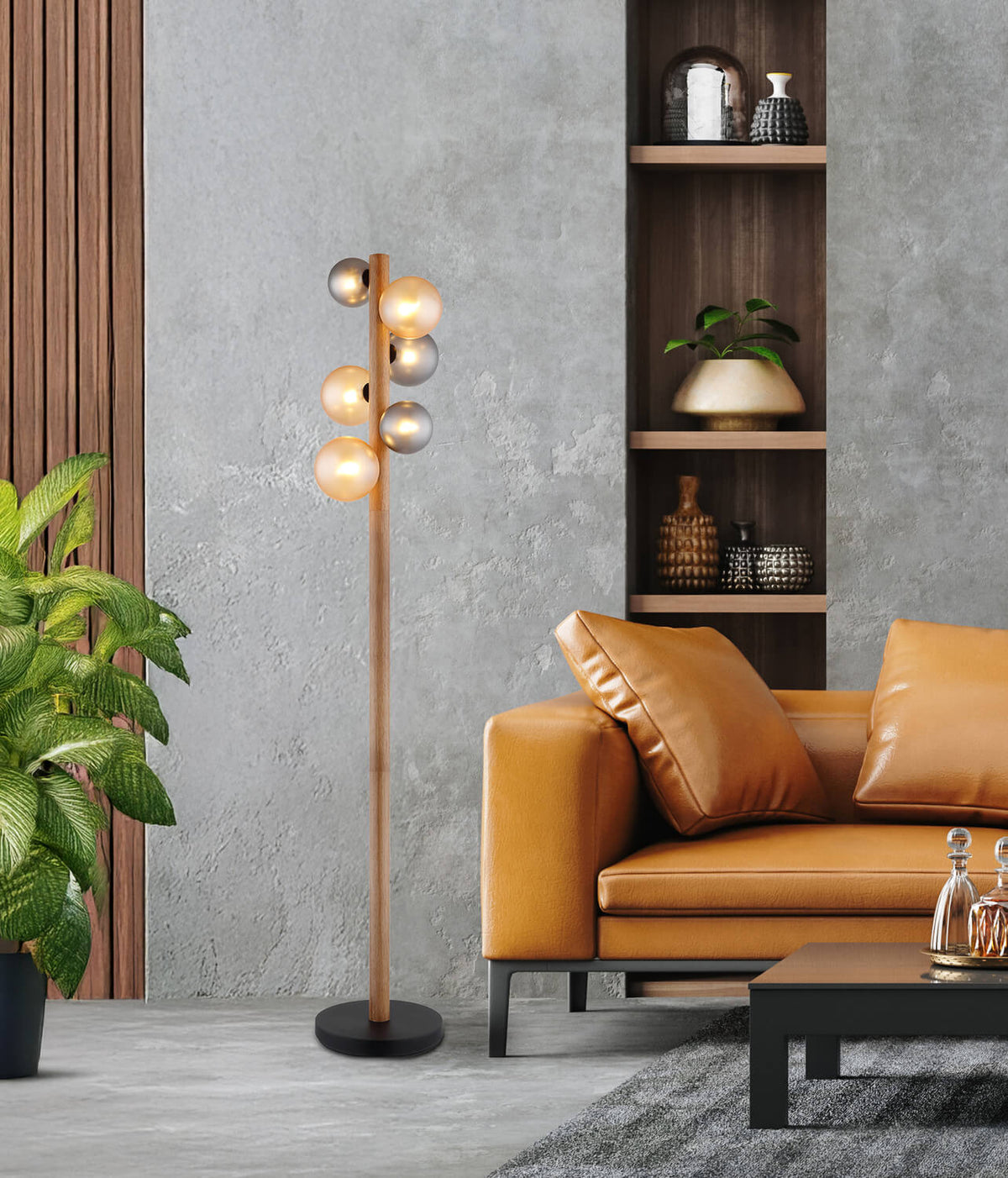 Mise en ambiance salon : lampadaire devant mur béton, canapé cuir et étagère
