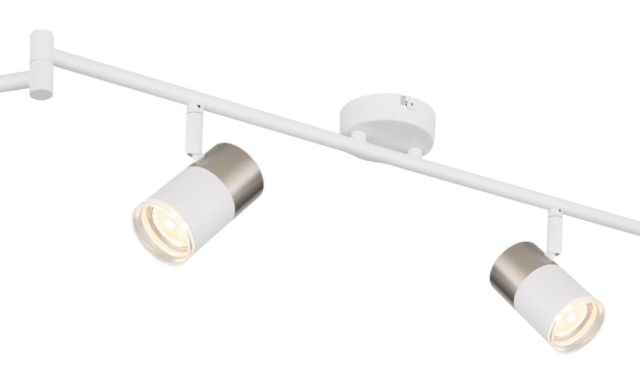 Détail rapproché d'un projecteur : corps blanc mat et capot gris métallisé
