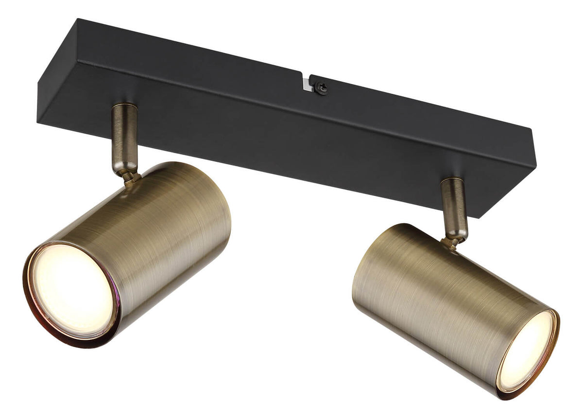Luminaire de face sur fond blanc, deux spots cylindriques orientables sur base noire