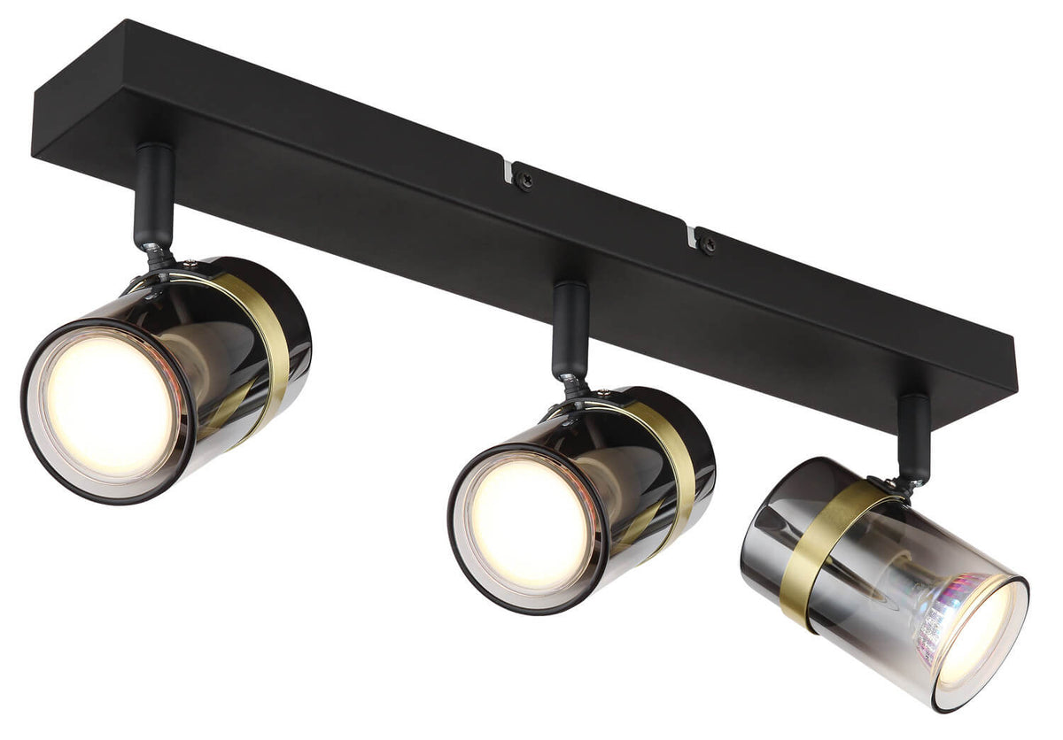 Trois spots cylindriques orientables fixés sur une barre rectangulaire noire mate.