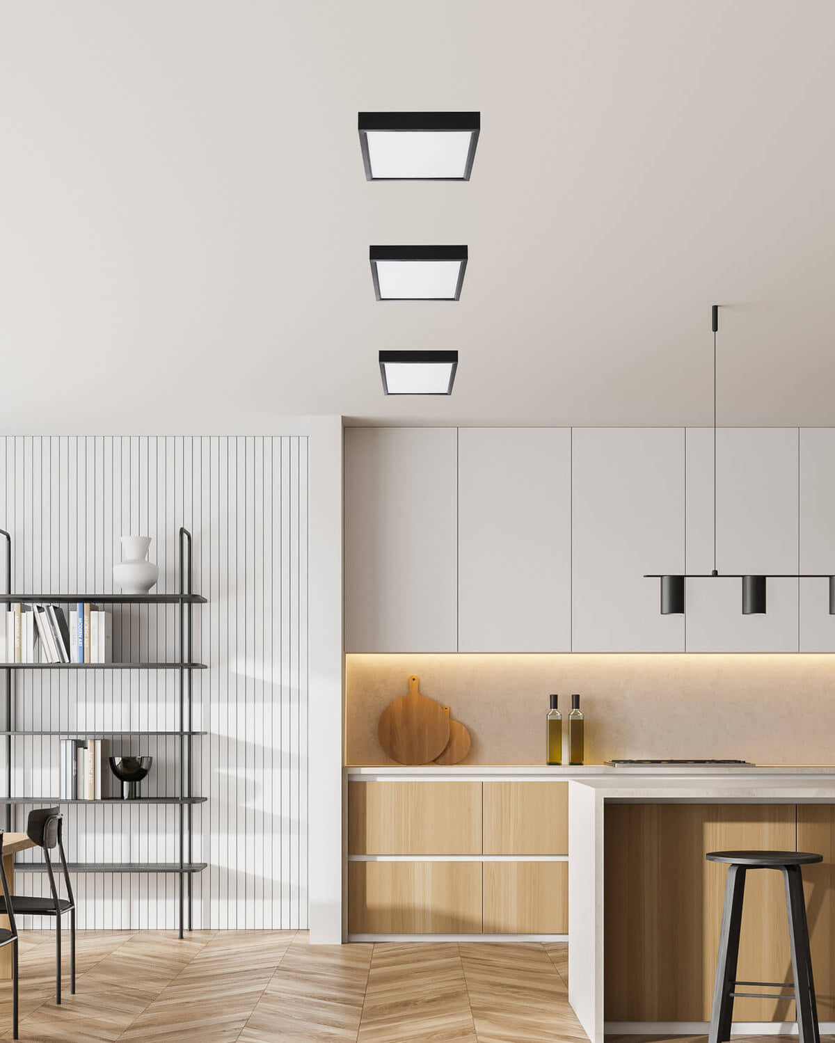 Trois plafonniers carrés noirs alignés au plafond d'une cuisine moderne