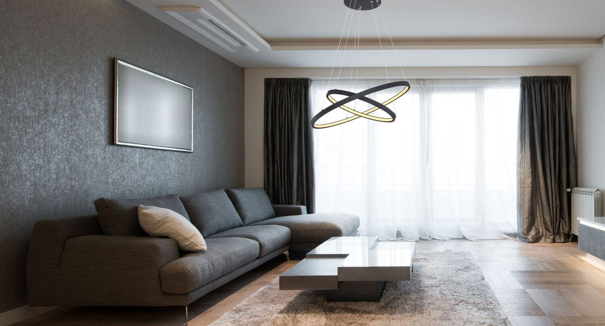Mise en ambiance du luminaire suspendu dans un salon gris moderne