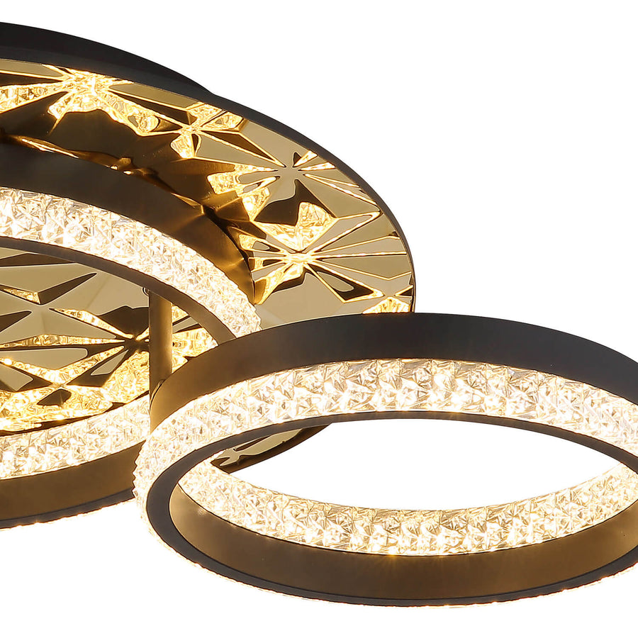 Détail de la finition noire mate, du motif géométrique doré et du ruban LED.