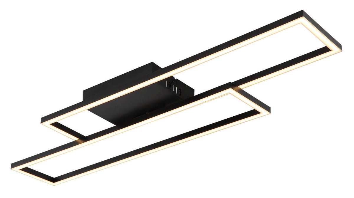 Vue rapprochée de deux rectangles croisés, finition noir mat et lumière chaude