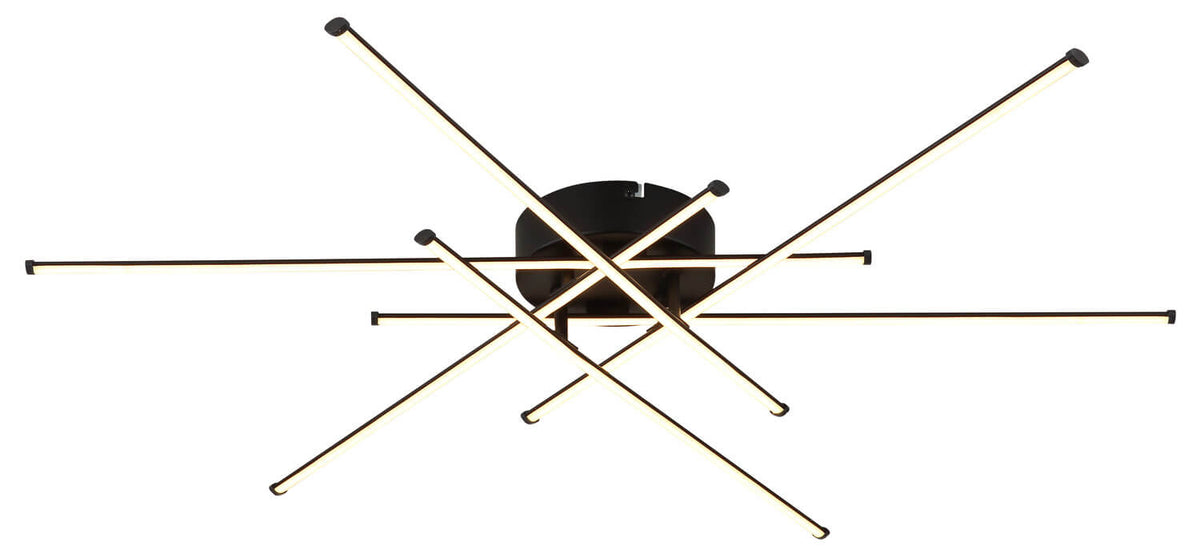Vue de face du luminaire LED allumé, tiges fines et diffuseurs lumineux bien visibles.