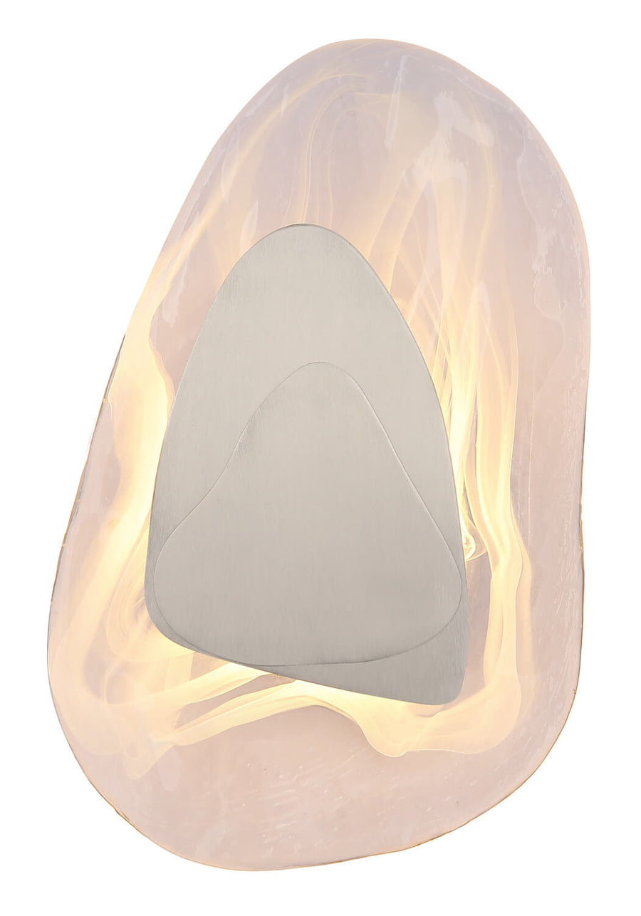 Vue de face du luminaire allumé, halo chaud traversant le verre