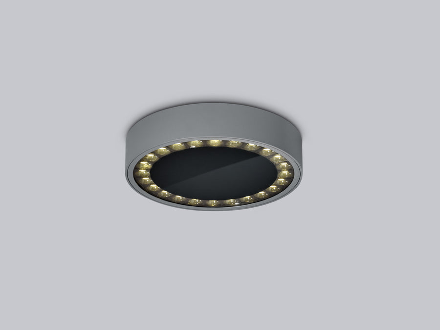Vue rapprochée du plafonnier anthracite montrant l'anneau lumineux et le diffuseur noir