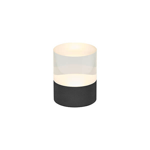 Vue en plongée de la lampe cylindrique, montrant le diffuseur translucide et la lumière chaude interne.