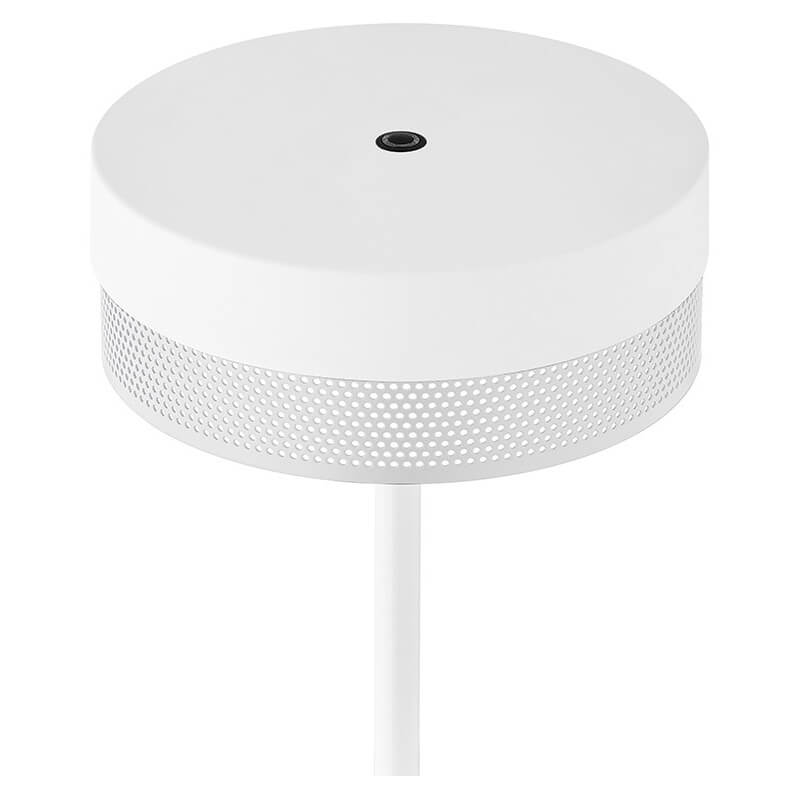 Détail du diffuseur cylindrique blanc perforé avec capteur central noir.