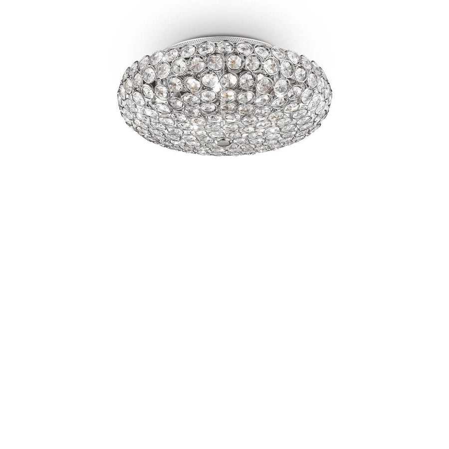 Plafonnier rond chromé entièrement garni de cristaux, vue de face sur fond blanc.