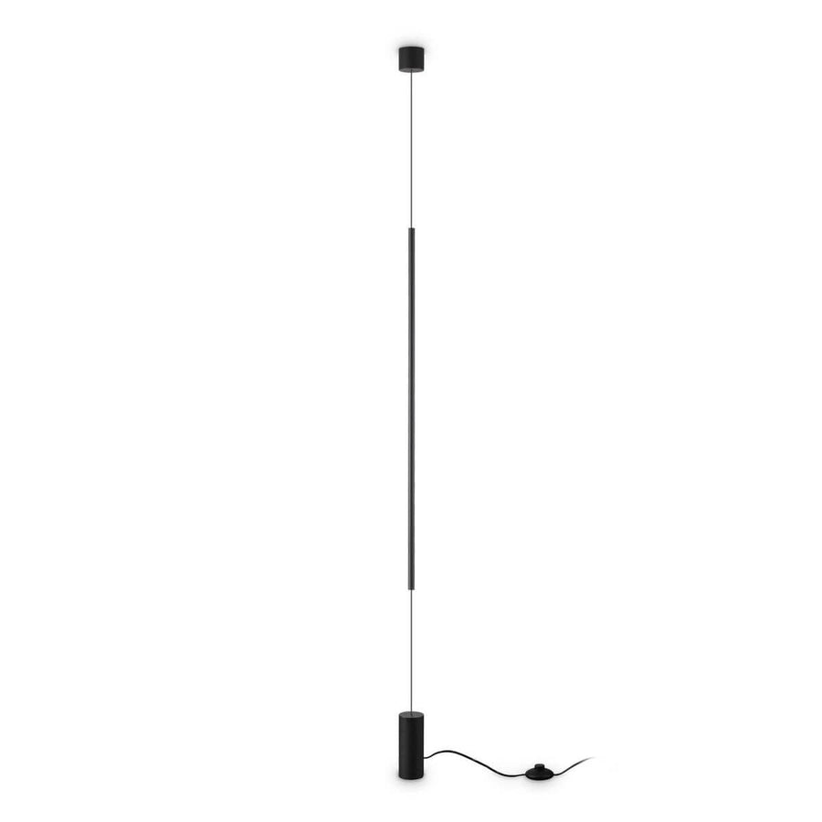 Lampadaire noir entier sur fond blanc, base cylindrique, tube lumineux vertical et fixation haute