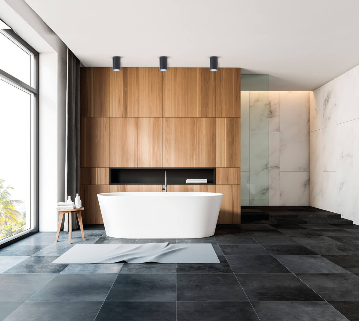 Mise en ambiance dans une salle de bain moderne avec trois spots au plafond.