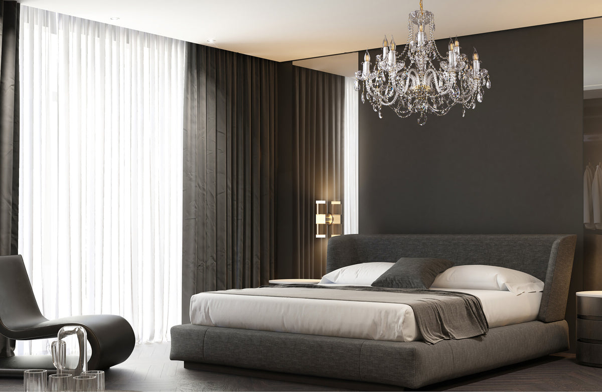 Mise en ambiance d'une chambre moderne sombre avec le lustre suspendu au-dessus du lit.