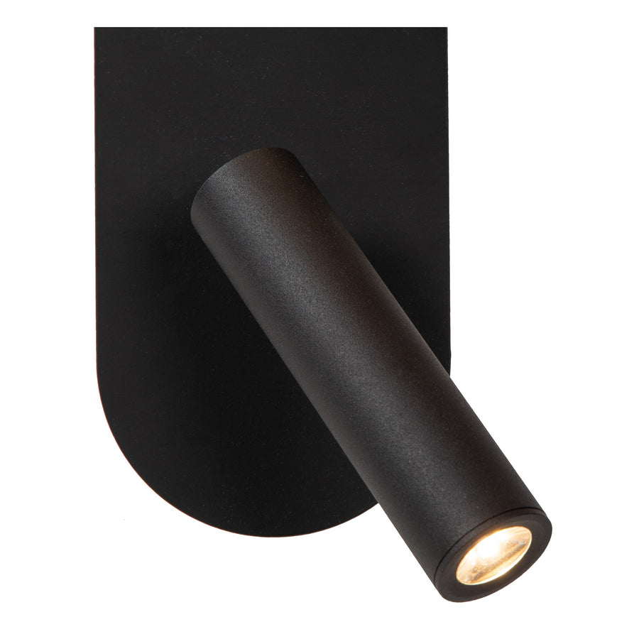 Détail du projecteur cylindrique orientable et de la platine ovale en métal noir.