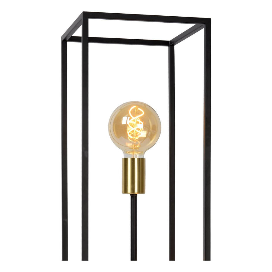 Détail du sommet avec ampoule globe et douille dorée dans le cadre noir