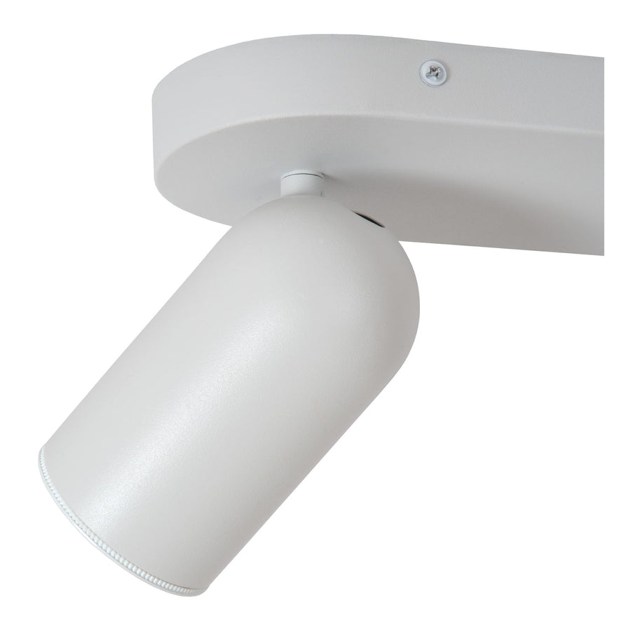 Gros plan sur un spot cylindrique blanc et sa rotule de fixation