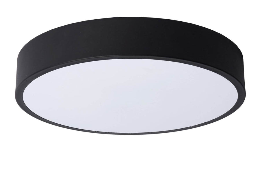 Plafonnier rond noir à diffuseur blanc laiteux, éclairage blanc, fond neutre.