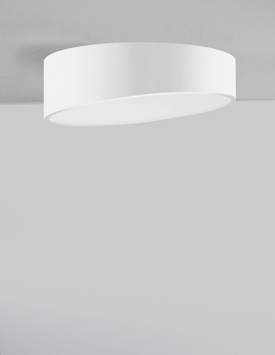 Plafonnier installé au plafond, vue de face montrant le disque lumineux