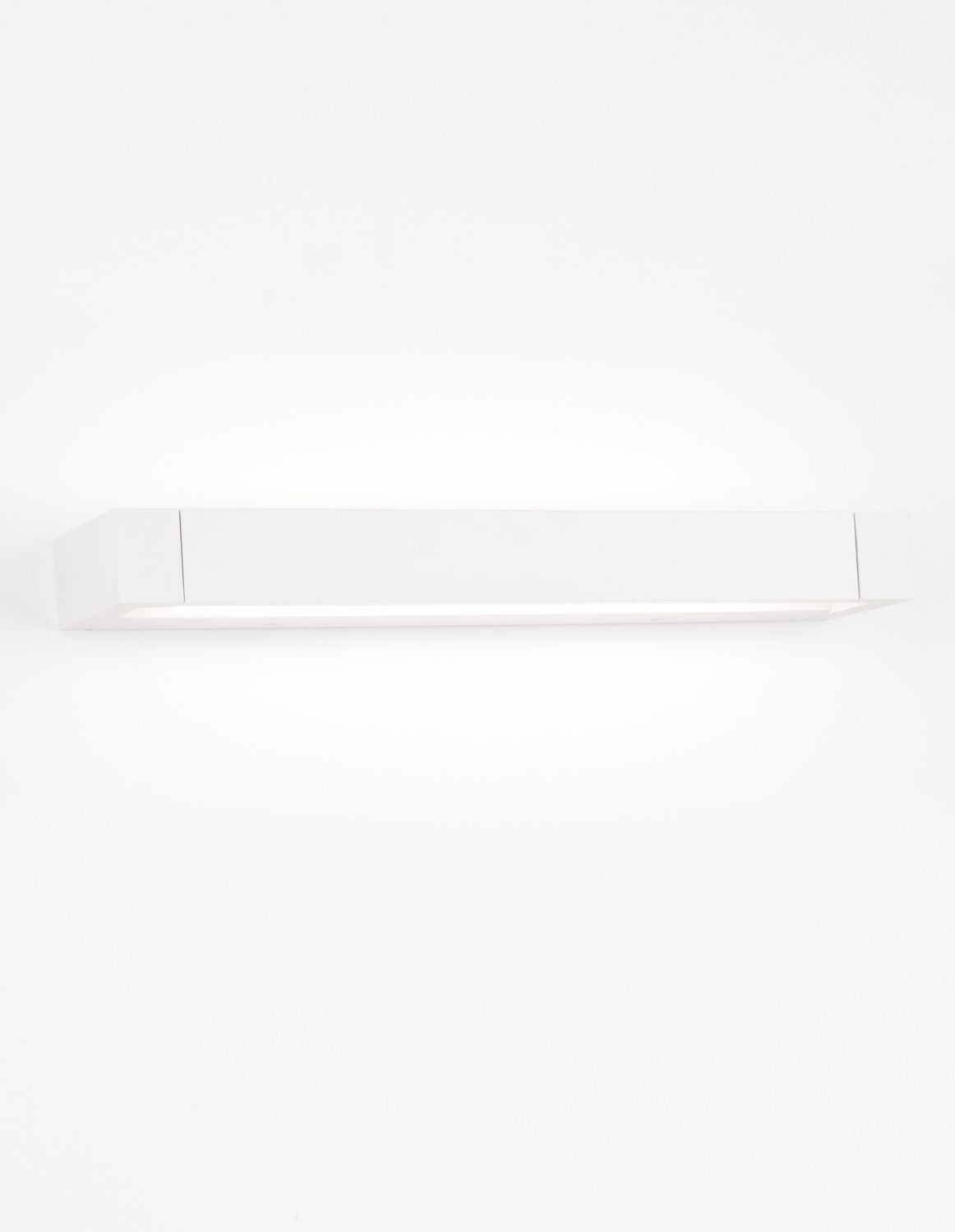 Vue frontale du caisson blanc allumé diffusant une lumière douce vers le bas