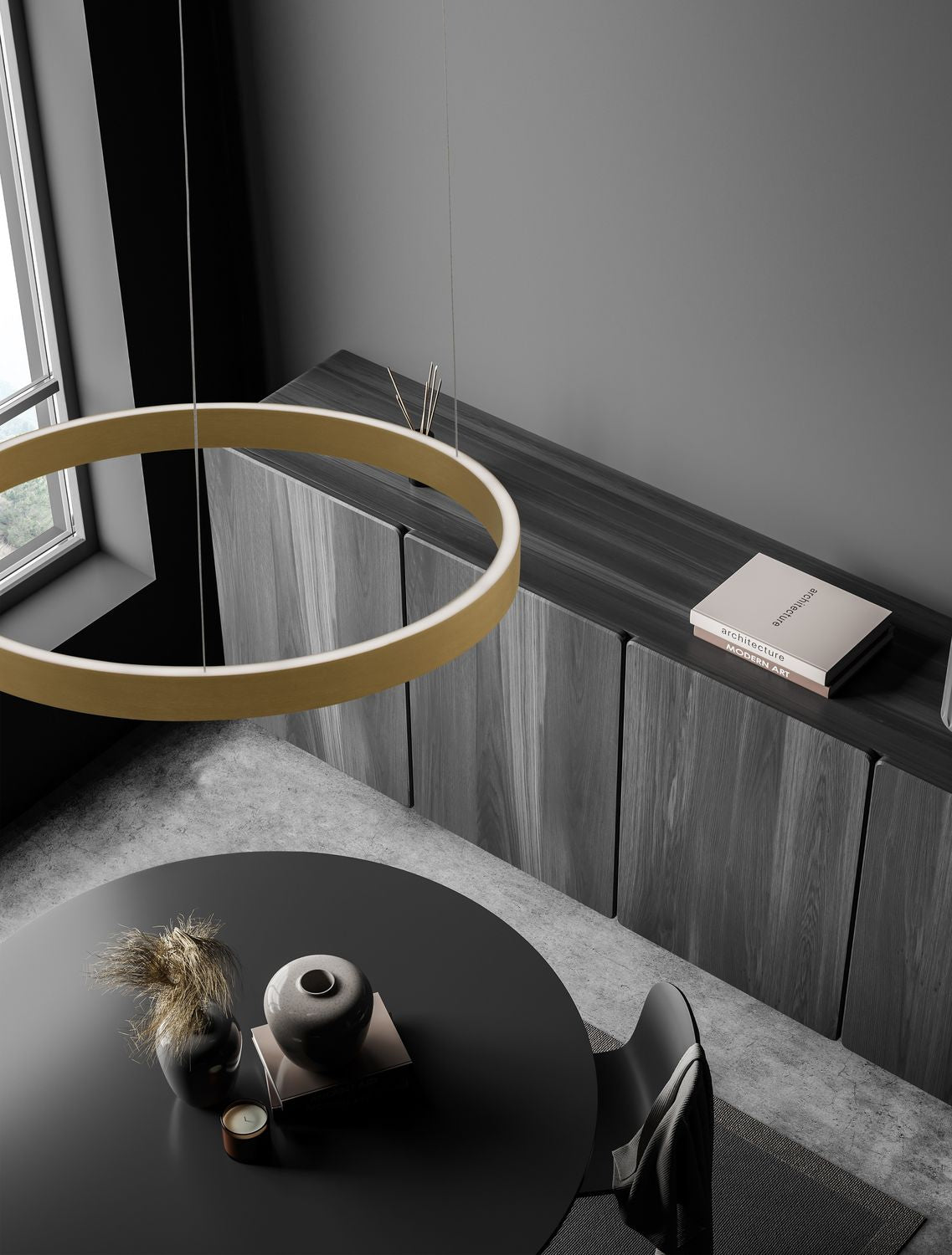 Suspension anneau doré installée au-dessus d'une table ronde dans une pièce sombre