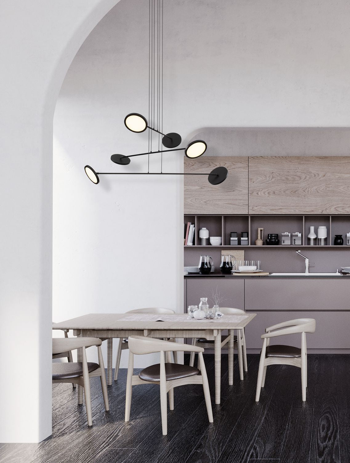 Suspension noire à disques lumineux suspendue au-dessus d'une table de salle à manger