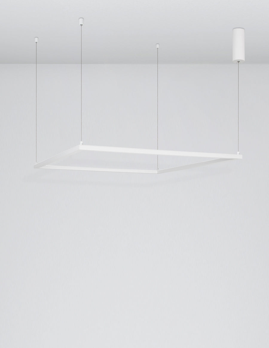 Cadre carré blanc vu de trois quarts avec son ombre portée sur le mur