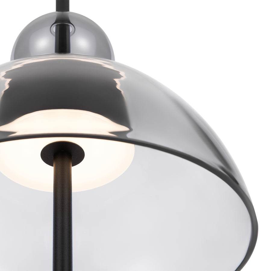 Gros plan sur le verre fumé et la lumière chaude du diffuseur opale