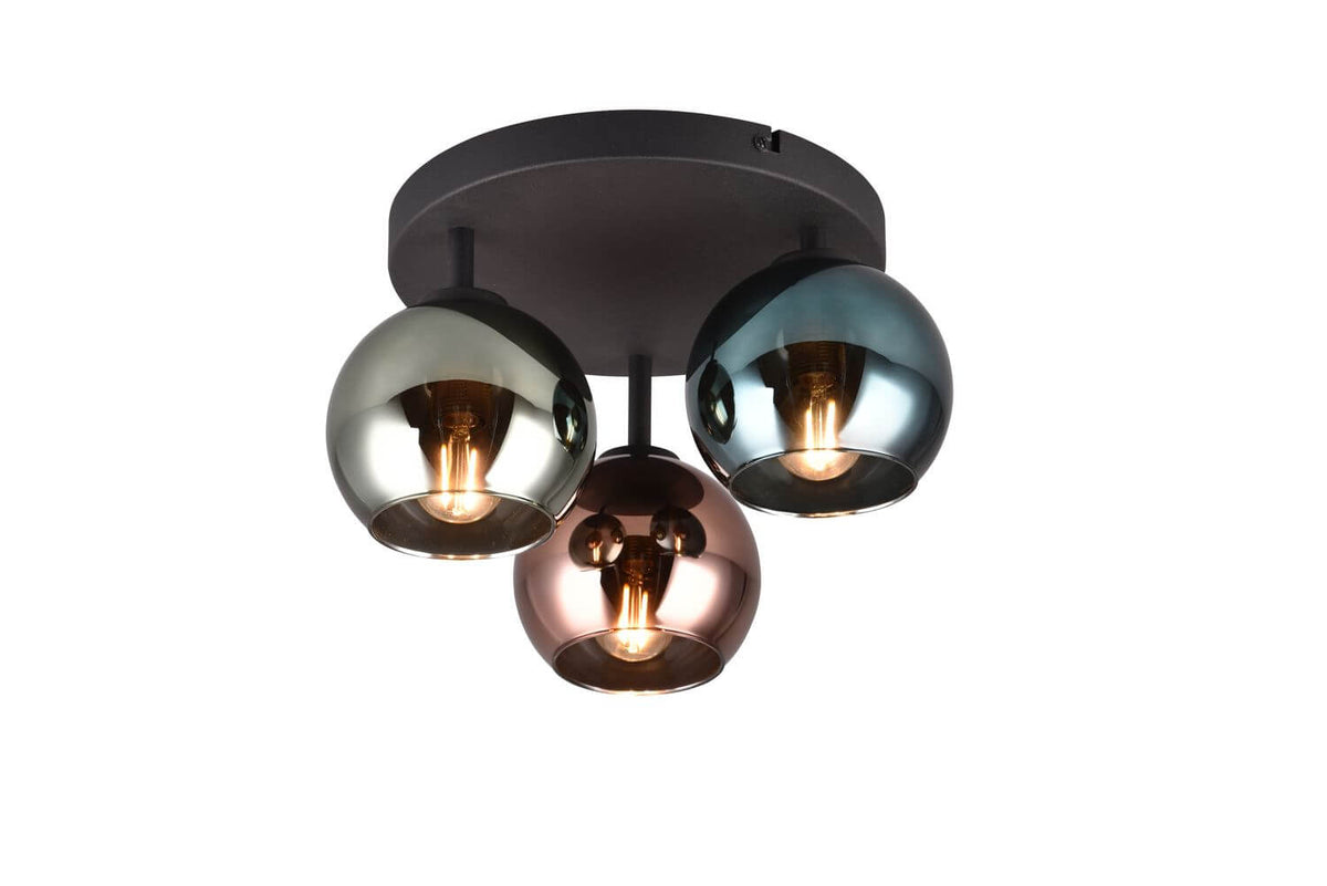 Vue de face du luminaire, base ronde noire et trois sphères colorées suspendues