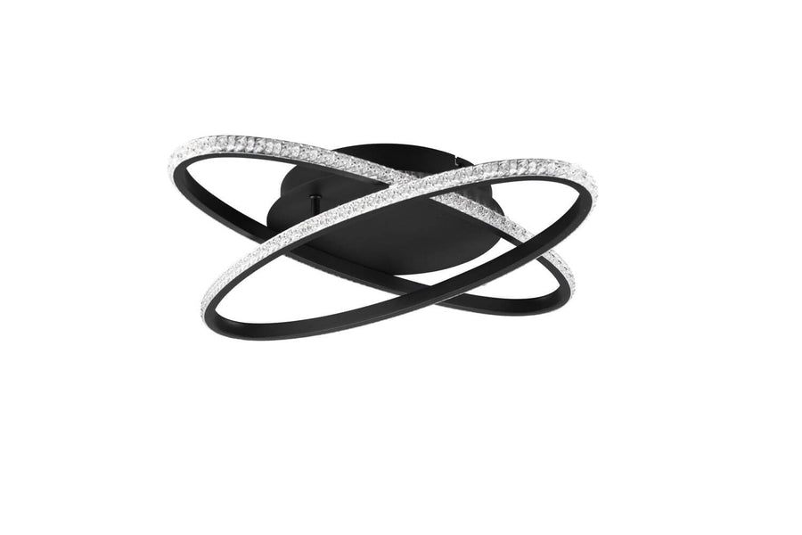 Détail du plafonnier noir mat, anneaux croisés et surface LED scintillante très lumineuse.