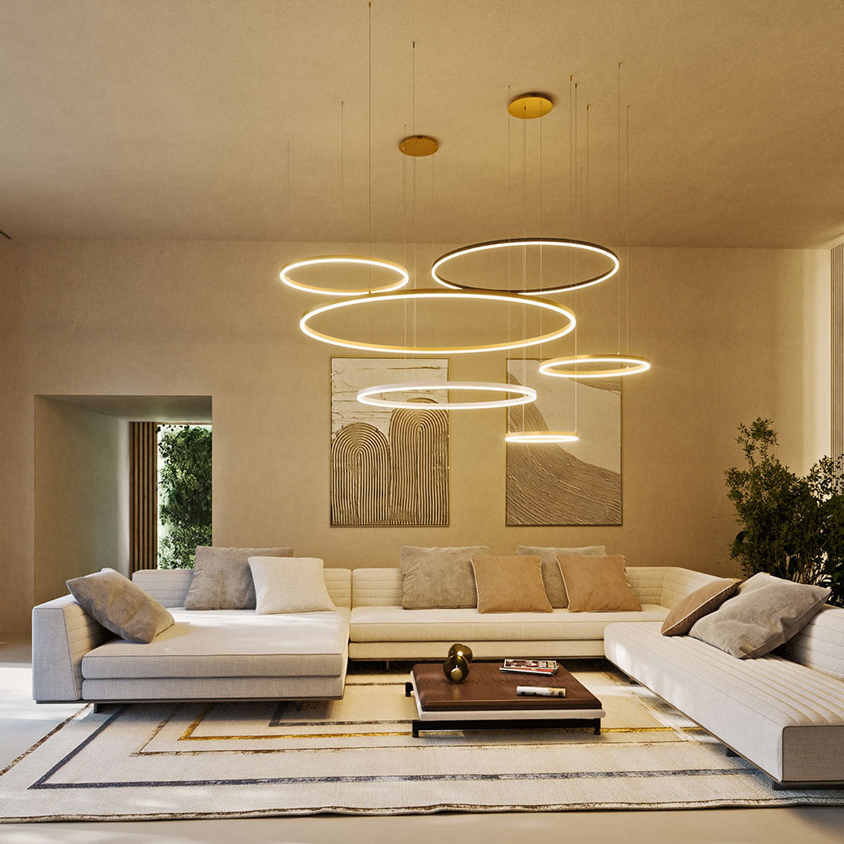 Mise en ambiance salon : plusieurs anneaux lumineux suspendus à hauteurs différentes