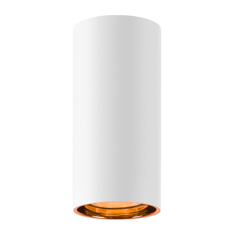 Vue du spot cylindrique blanc sous un autre angle, avec reflet cuivré à la base.