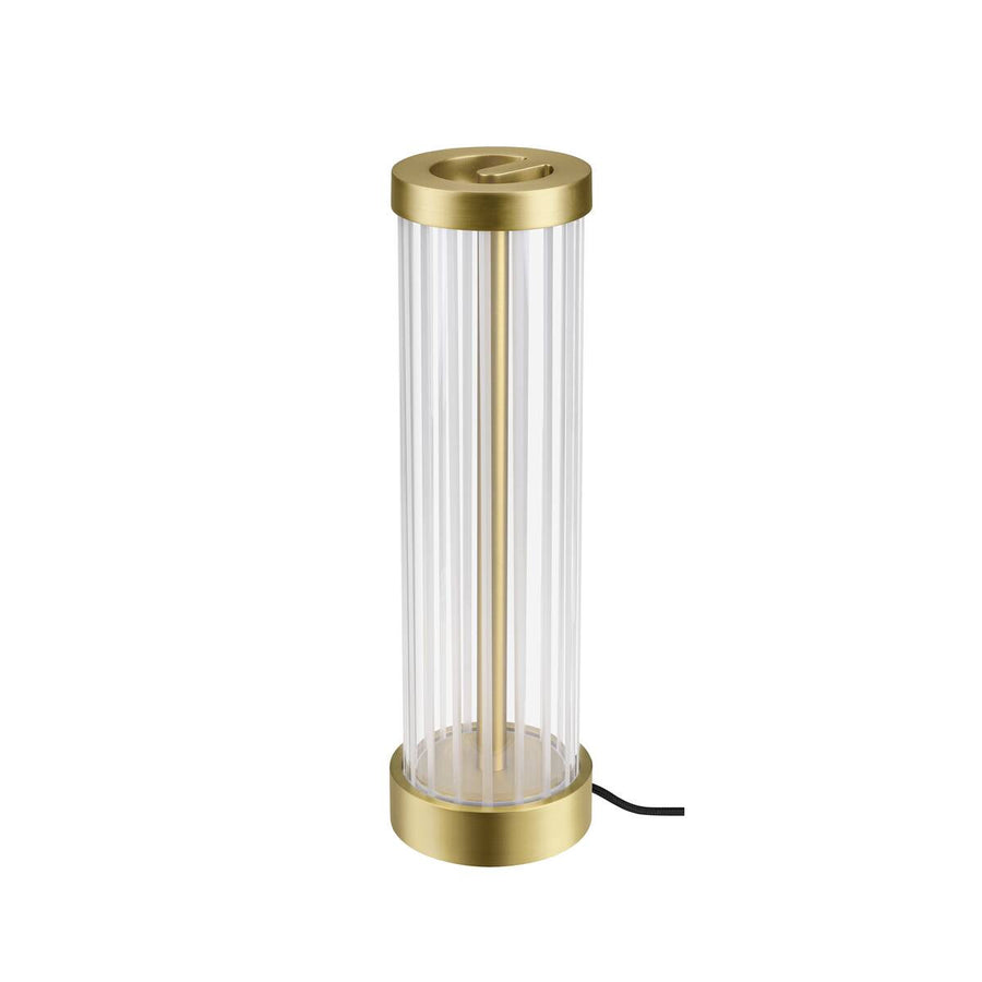 Lampe présentée de trois quarts, montrant le cylindre en verre et la base dorée.