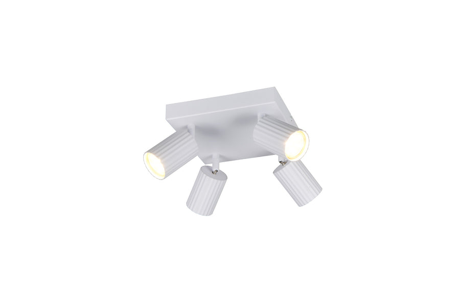 Vue rapprochée des quatre cylindres striés orientables, plafonnier blanc mat allumé