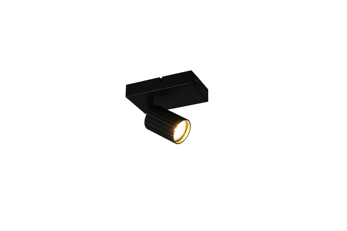 Spot noir mat fixé sur support rectangulaire, tête cylindrique inclinée vers le bas.