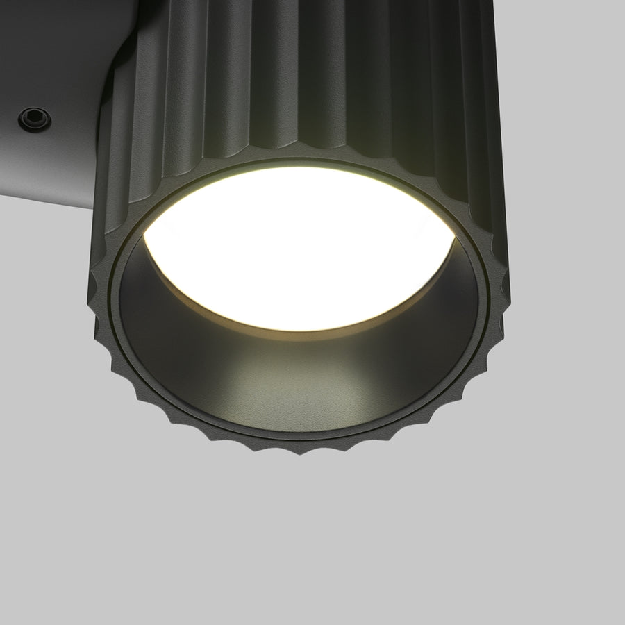 Détail rapproché du bas du cylindre cannelé et de son diffuseur LED allumé