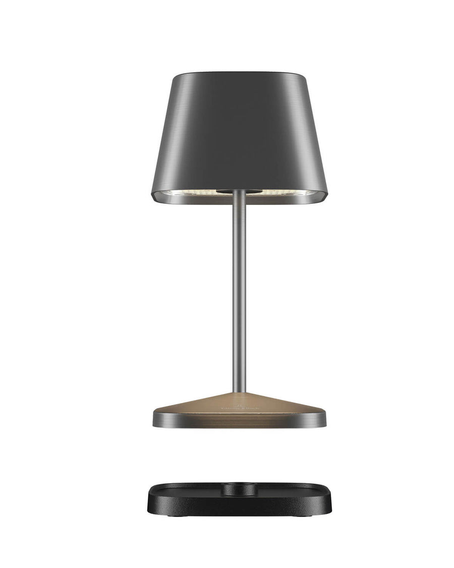Vue éclatée de la lampe anthracite, base et socle de charge séparés.