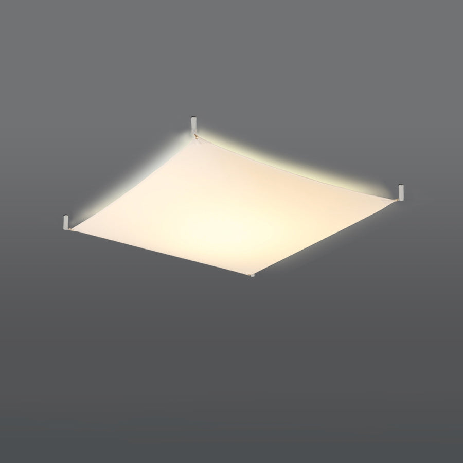 Diffuseur carré allumé émettant une lumière chaude sur fond gris foncé